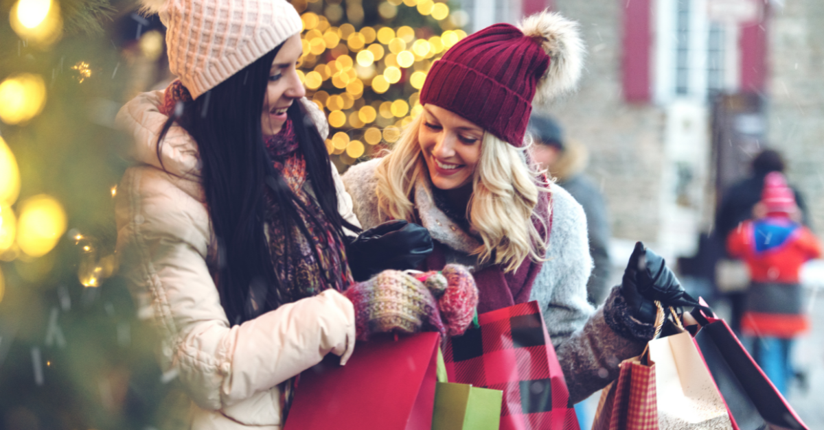 Two women holding shopping bags